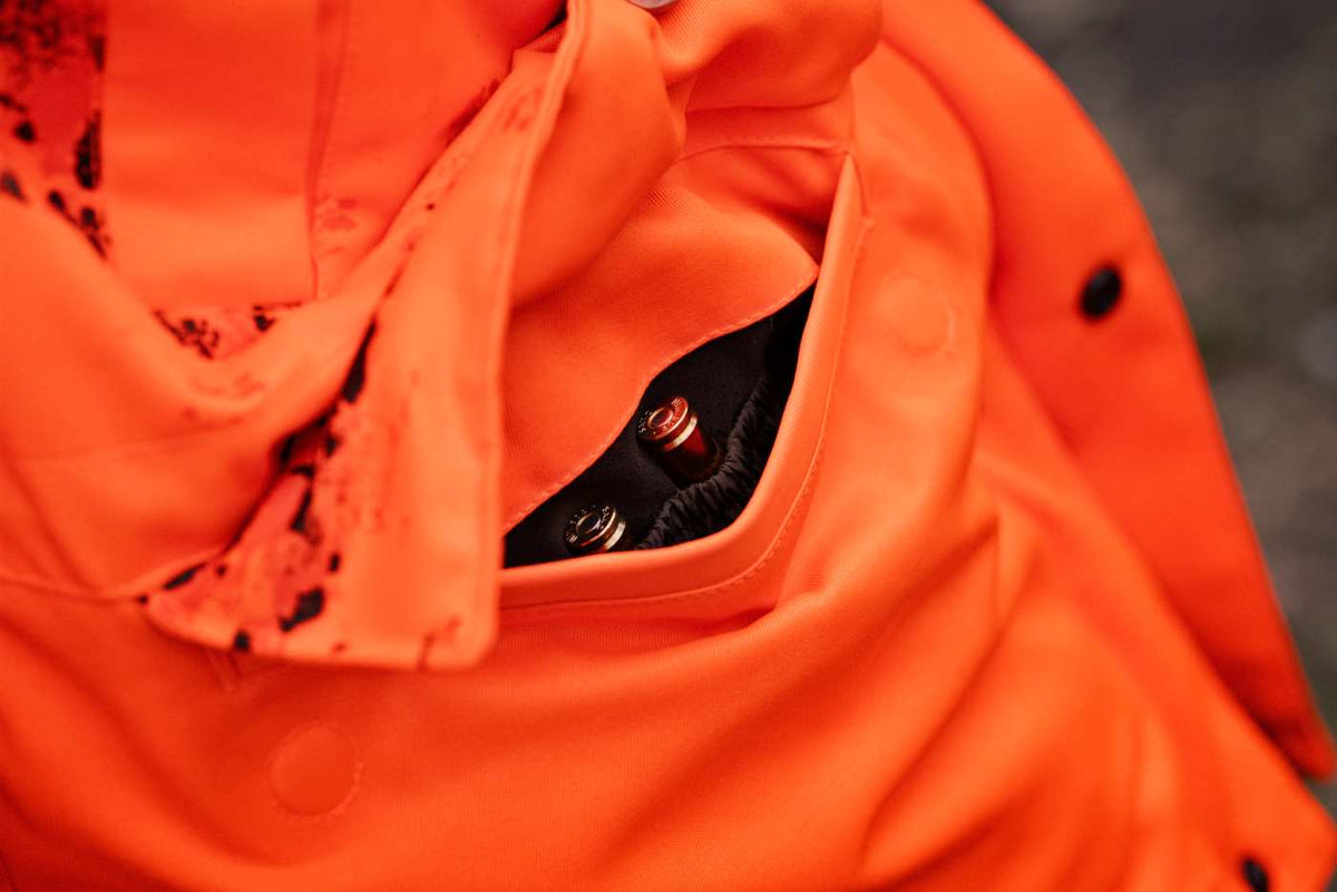 Härkila Herren Jagdjacke Wildboar Pro Blaze Camo HWS Insulated in AXIS MSP®CE orange – Taschendetail