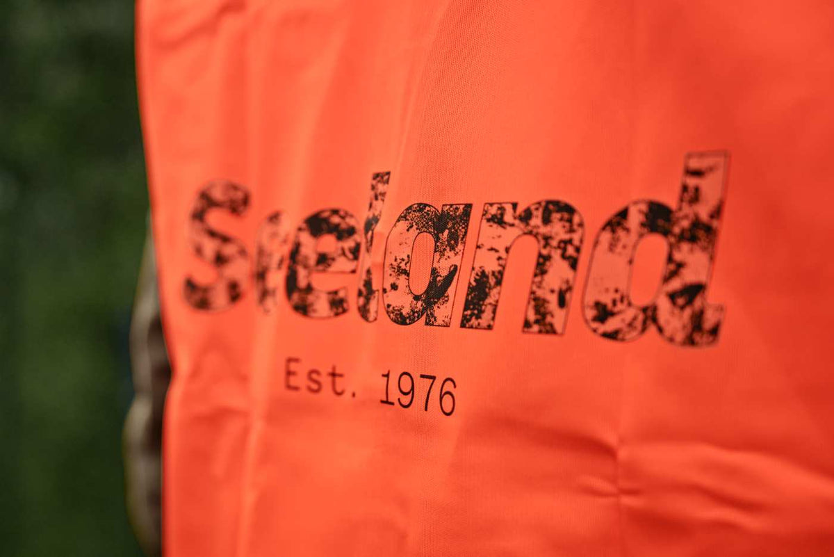 Seeland Signalweste in Orange blaze – Rückenlogo